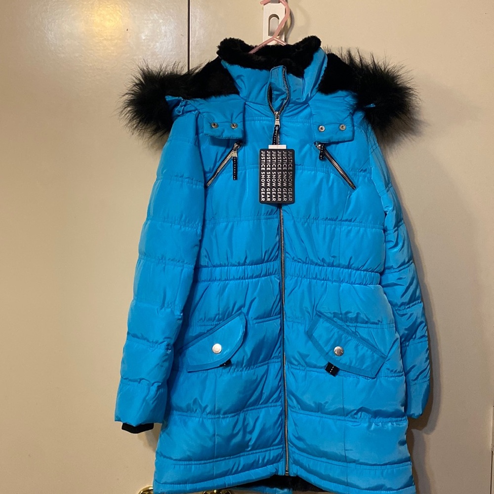 Warm winter coat lined with black fur for girls size 12 in new condition